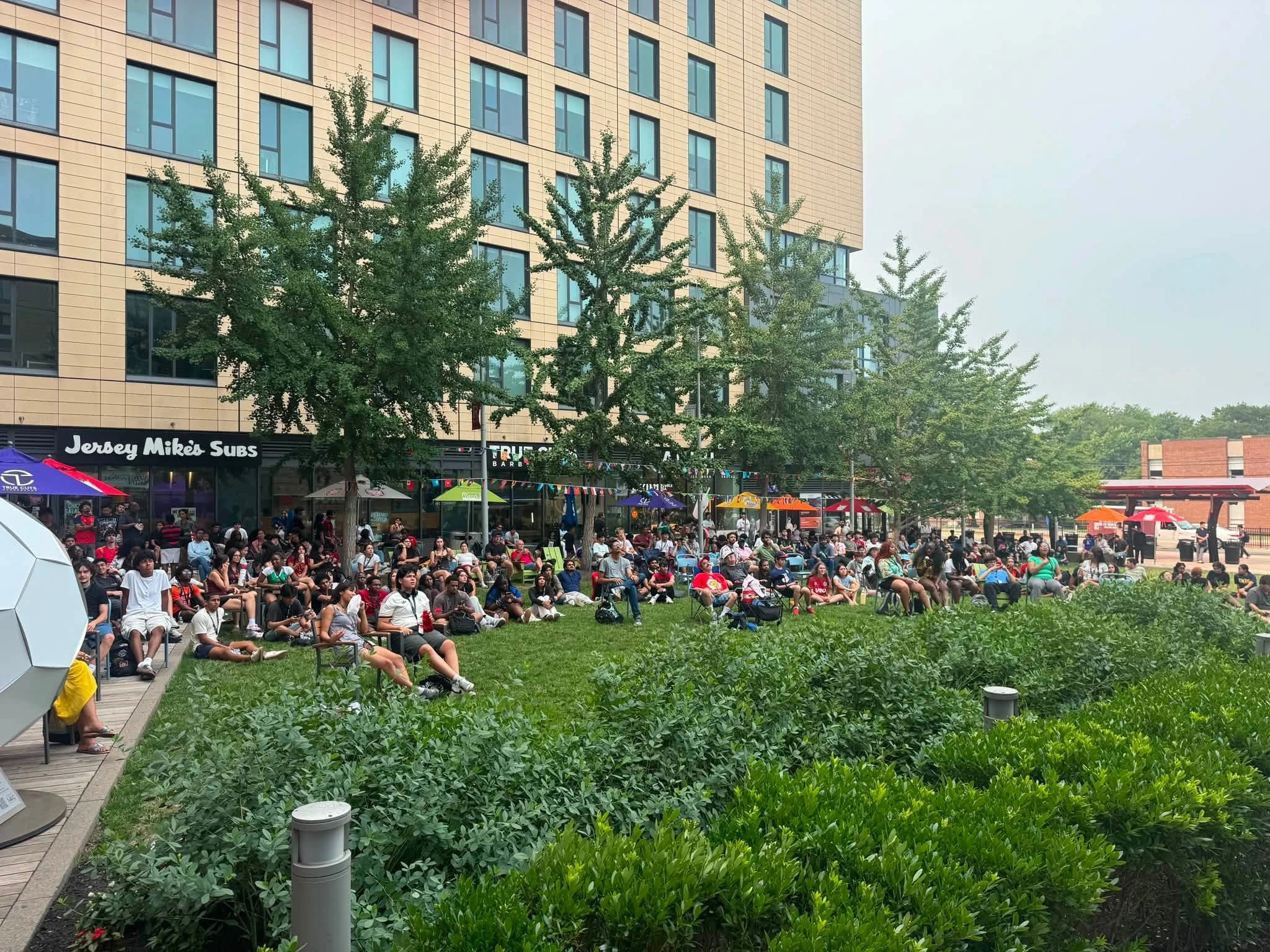 CBRE World Cup Watch Party at The Yard at Rutgers New Brunswick - DJ Reese on the mic during the CBRE community activation