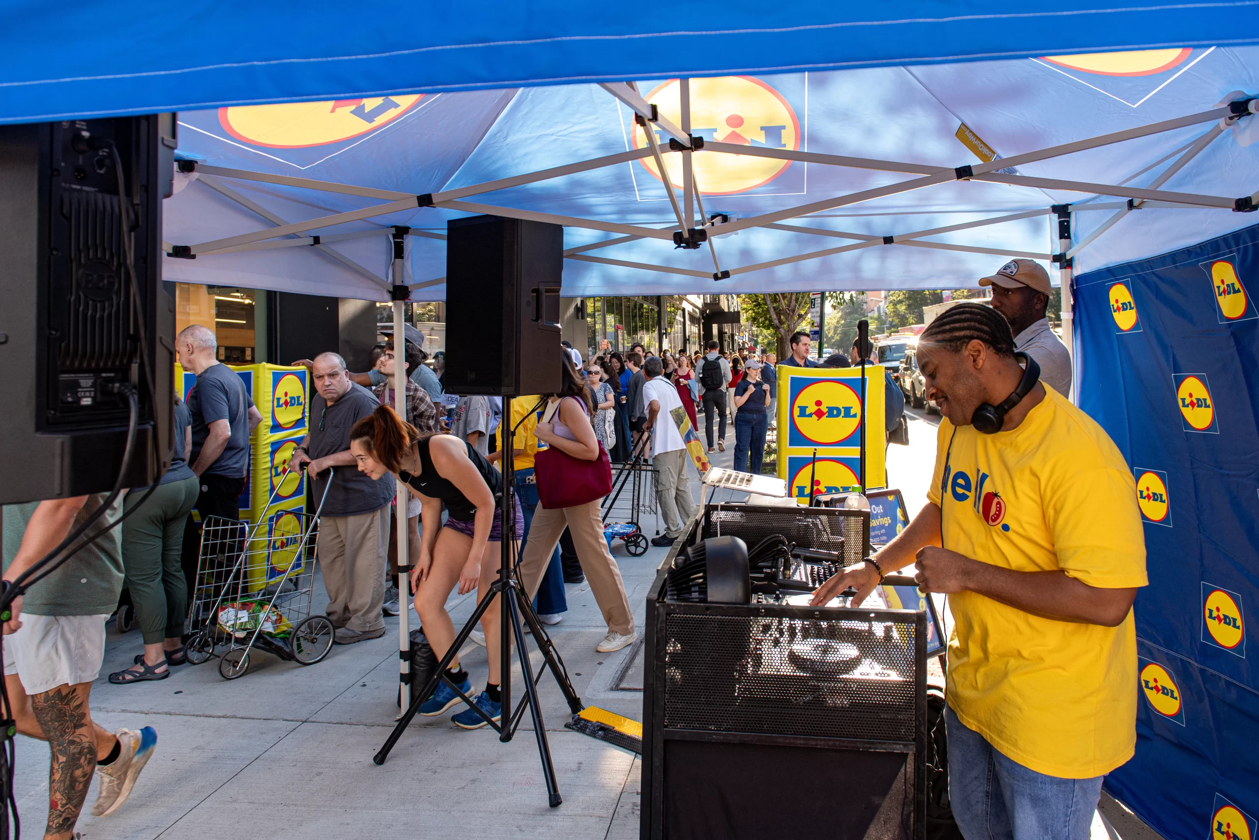 DJ Reese emceeing a Lidl US grand opening in Brooklyn, NYC