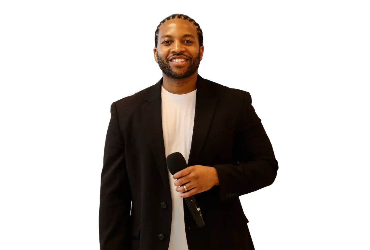 DJ Reese of No Stress Zone Entertainment, corporate event emcee holding a microphone